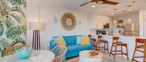 Colorful, mid-century vibe for this Keys tropical open concept living/dining area