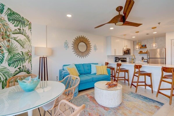 Colorful, mid-century vibe for this Keys tropical open concept living/dining area