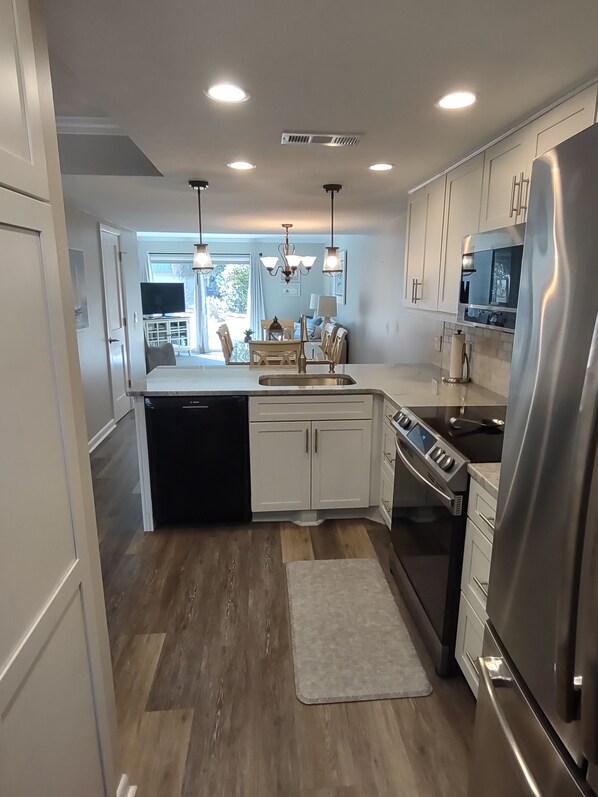 Open concept kitchen with full sized appliances