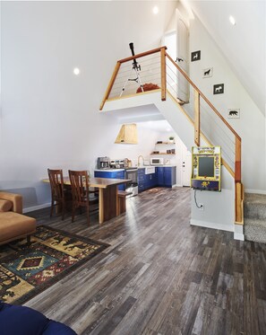 Open concept living room, dining and kitchen with 50" 4k Roku TV
