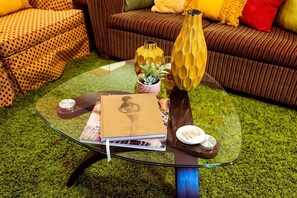 Enjoy reading material, or relax on the cozy furniture amongst the groovy vibes