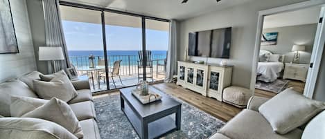 Living room is spacious with an amazing view of the Gulf of Mexico and the lagoon pool