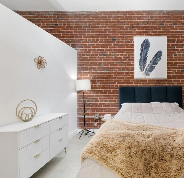 Queen-sized bed with a functional working desk