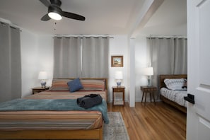 Our first cozy bedroom has 1 king bed and 1 queen size bed.