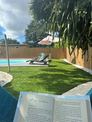 Relax in the hammock chair, reading a good book (many are provided).