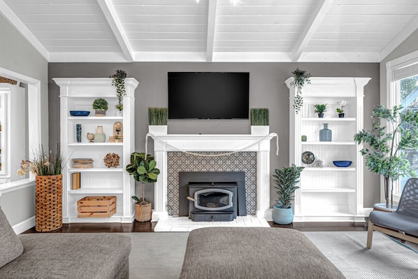 Enjoy plenty of natural light, a cozy fire, and family time in the living room.