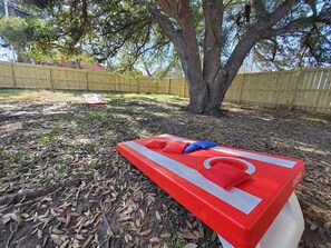 Corn hole is provided.