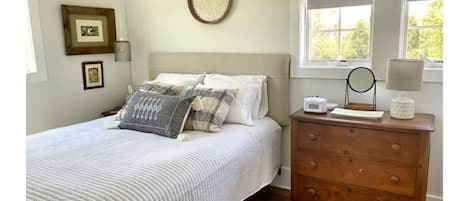 Queen bedroom.  Dresser provided for clothing with hangers.