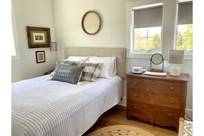 Queen bedroom.  Dresser provided for clothing with hangers.