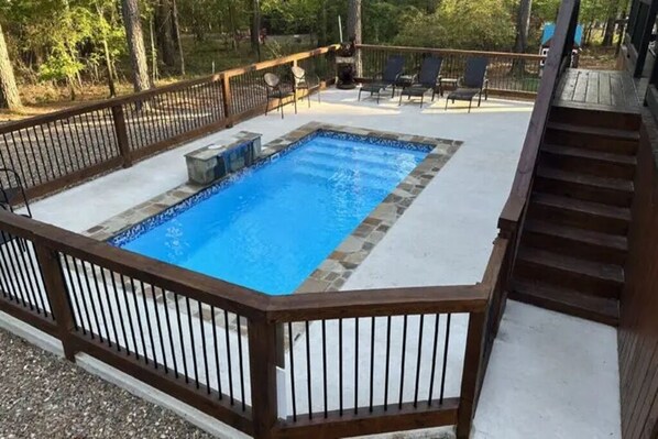 Pool with Fence and Chairs