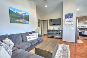 Living room with plush sleeper sofa and SmartTV