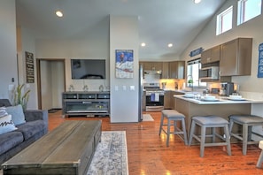 Open living room and kitchen with vaulted ceilings