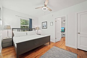 The spacious bedroom offers plenty of daylight, a king size bed and a smart TV.