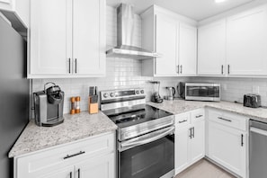 Fully-equipped kitchen complete with modern amenities.