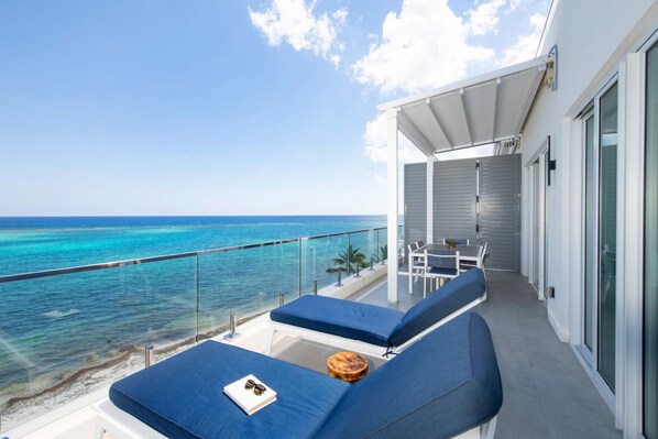 Relax and soak up the sun on this spacious balcony.