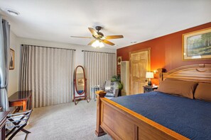 Master bedroom with a king size bed, and ton of closet space.
