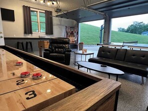 Main level game room can be opened to the outside. 