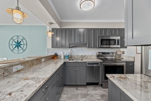 Fully stocked and spacious kitchen.