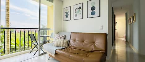 Living room with balcony view to natural landscape