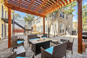 Fire pit, grills, table/chairs. lounge, and cornhole sets.