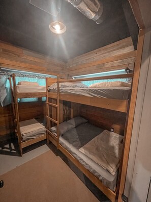 First bedroom has a full sized bunk bed, and a twin sized bunk bed. 