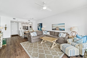 Living Room | Take it Breezy |Breathe Easy Rentals - Open living area for everyone see and hear what's happening for the day. Enjoy the coastal vibe with the muted but colorful furnishings and decor through out. Sofa has a pull out queen bed.