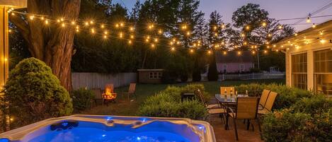 Stunning backyard w/ party lights, hot tub, outdoor dining & fire-pit!