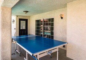 Covered patio with a ping pong table