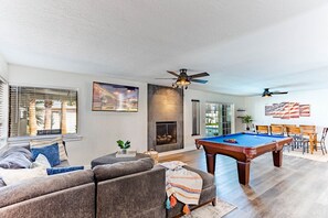 Spacious living area with a pool table
