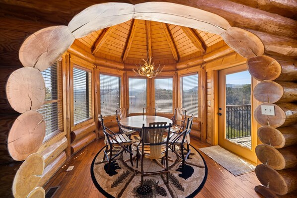Watch the sunrise in this dining area surrounded with a panoramic mountain view.