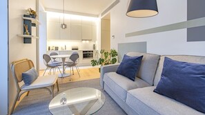 Spacious and modern living area with blue and grey accents and natural light in the heart of Lisbon. Perfect for relaxation and a memorable stay #andoliving #modern #relax #memorablestay #lisbon #pt #portugal