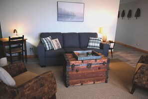 Comfort meets rustic charm as you relax for a movie or to take in the lake views
