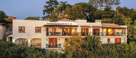 Exterior of home featuring 7 balconies