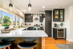 The kitchen is fully equipped with wine fridge, Keurig and coffee pods.