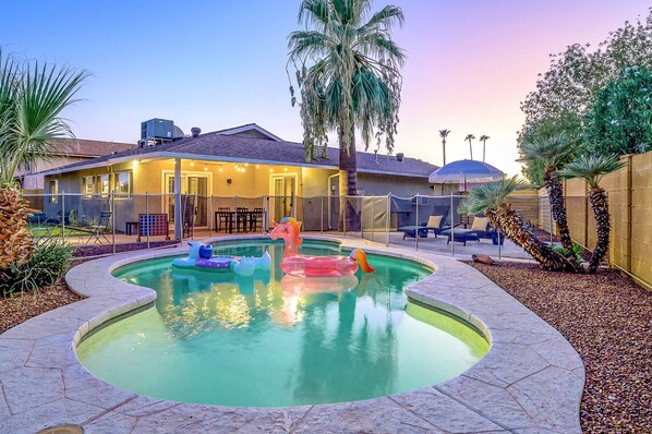 Your backyard oasis to enjoy complete with heated pool, firepit, games and more!