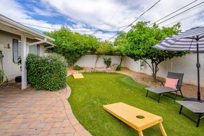 Play a game of cornhole in the spacious back yard.