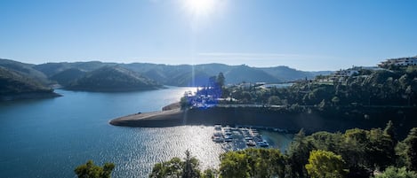 Serene balcony overlooking the majestic Castelo de Bode Lake and Marina.