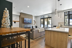 Modern kitchen looking into living room.