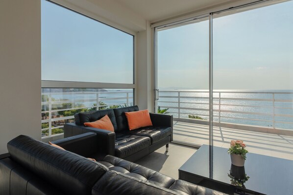 Living area and balcony with sea views