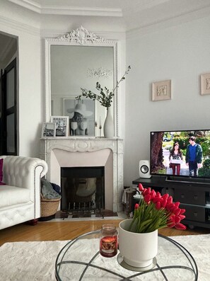 Charming 17th century moldings and original marble fireplace - classic Paris.