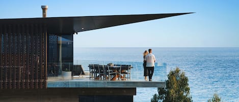 Expansive deck with seating and dining areas