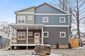 Welcome to your cozy home away from home, complete with a charming front yard and inviting porch