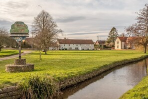 Cornloft Cottage, South Creake: The cottage viewed across the picturesque village green