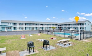 Picnic tables, yard games, and grills.