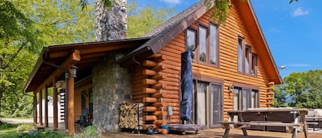 Relax on Scout’s Haven’s outside deck, complete with an in-ground hot tub.