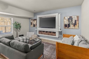 Movie nights just got better with our cozy TV room! Enjoy your favorite films on the big screen with comfortable seating options, including a sectional and twin bed with trundle for extra guests. And don't miss the XBox for a little gaming action.