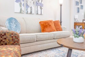 Unwind in style! Our cozy living room invites you to relax, recharge, and feel right at home.