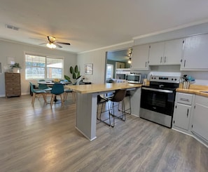 Fully stocked eat-in kitchen that opens to dining space - enough room for all!