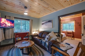 Settle in for a cozy night with snacks and drinks on the lovely coffee table.