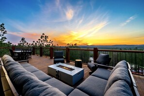 Make memories together around the fire table just off the game room.